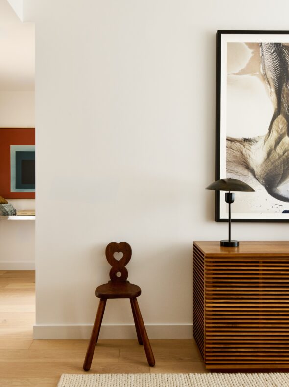 Hallway with modern art and ornate furniture
