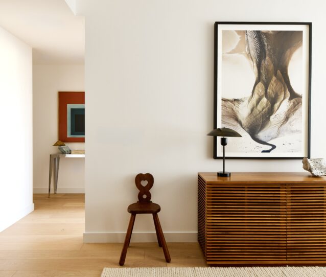 Hallway with modern art and ornate furniture
